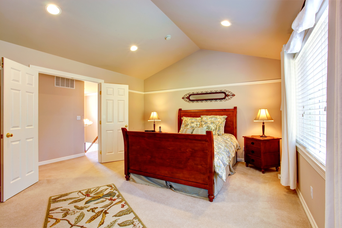 Light bedroom with vaulted ceiling